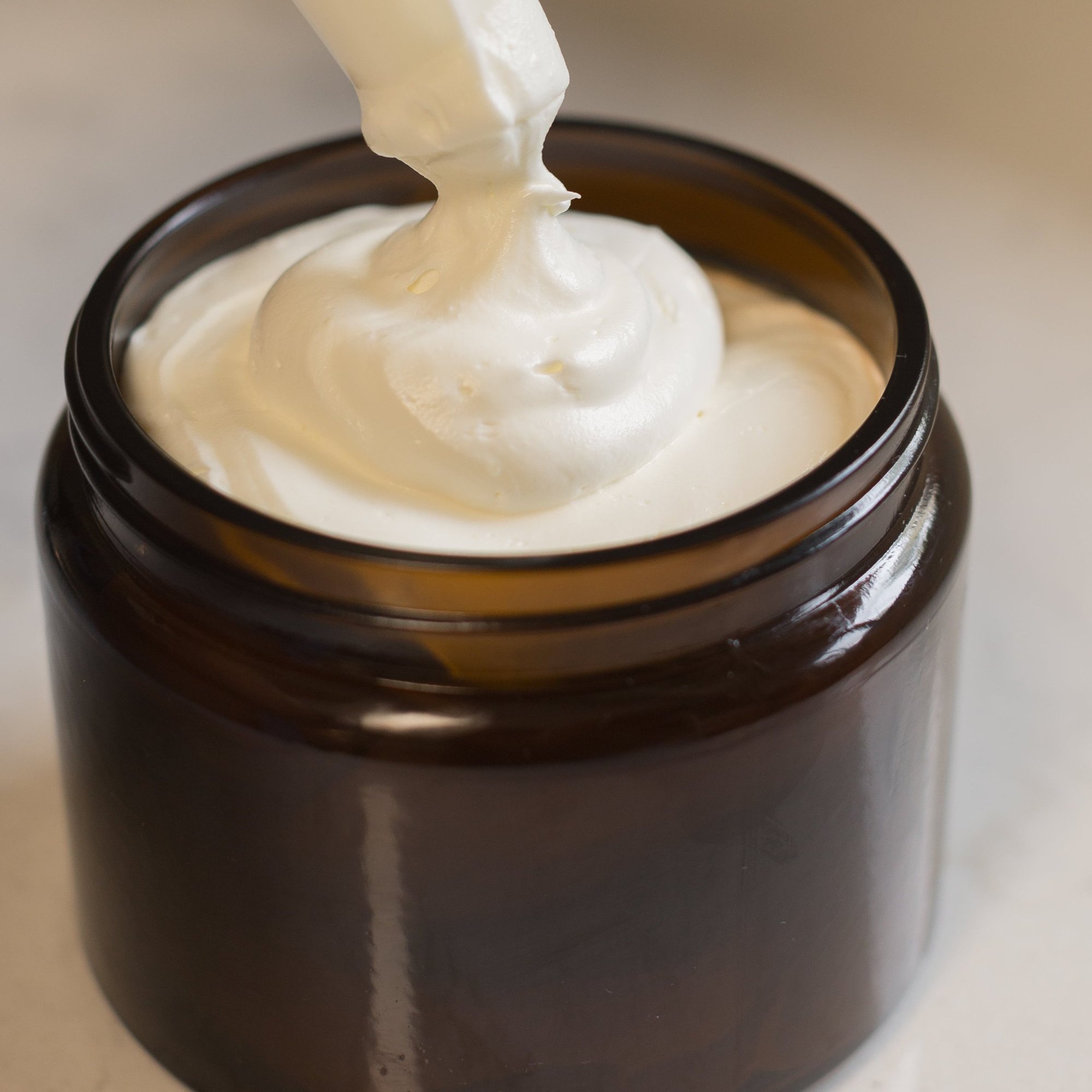 A dollop of HydroTallow whipped tallow in an open jar